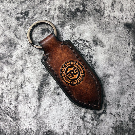 Motorcycle leather keychain in Brown(Pointed shape) Royal Enfield symbol is embossed