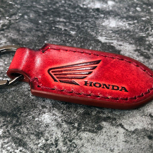 Motorcycle leather keychain in Red(Pointed shape) wing is embossed