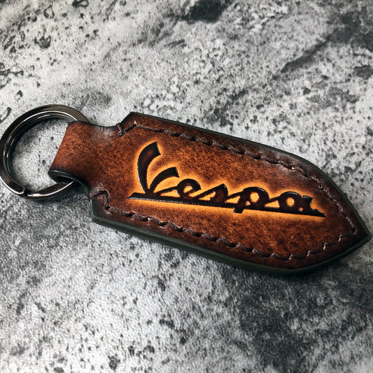 Vespa is embossed, handmade leather keychain in Brown(Pointed shape)