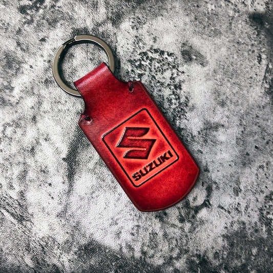 motorcycle leather keychain in Red. Suzuki is Embossed