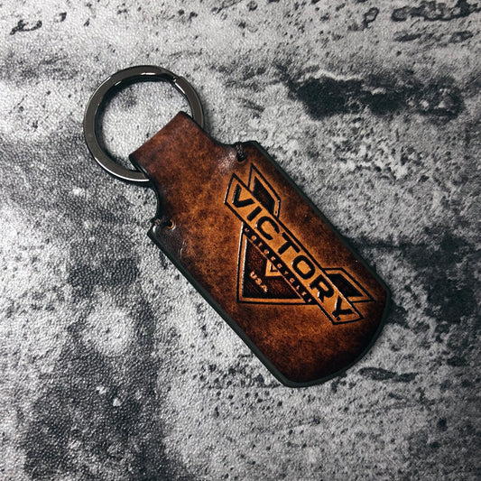Motorcyle vintage Leather keychain in Brown. Victory symbol is embossed