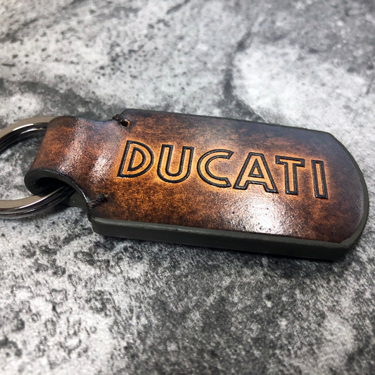 Embossed Ducati Classic font, Leather keychain in Brown. Customizable