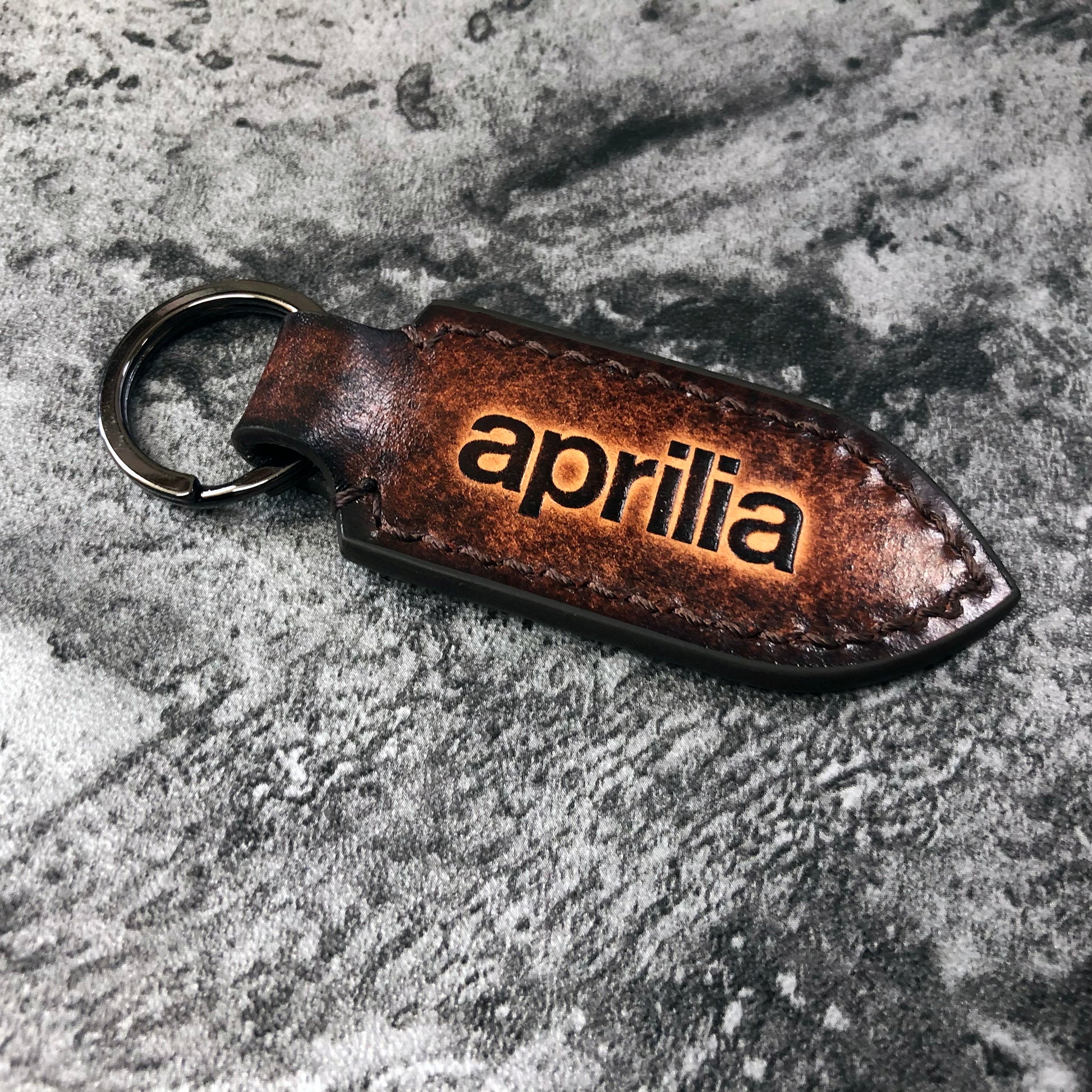 Aprilia is embossed, vintage Leather keychain in Brown(Pointed