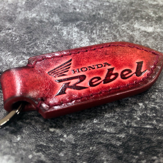 Motorcycle leather keychain in Red(Pointed shape) Rebel is embossed