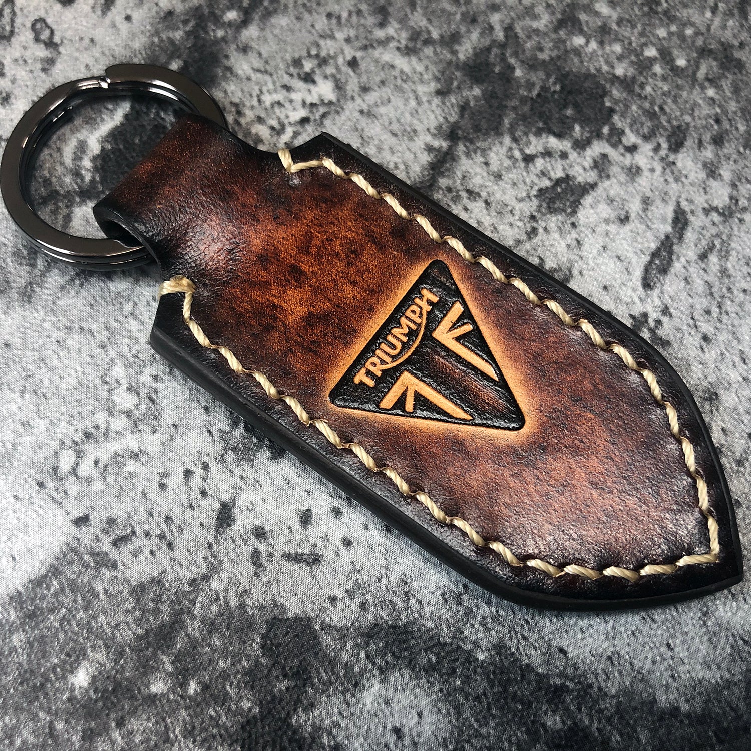 Handmade leather keychain in Brown(Pointed shape) Triumph triangle is ZEIDI