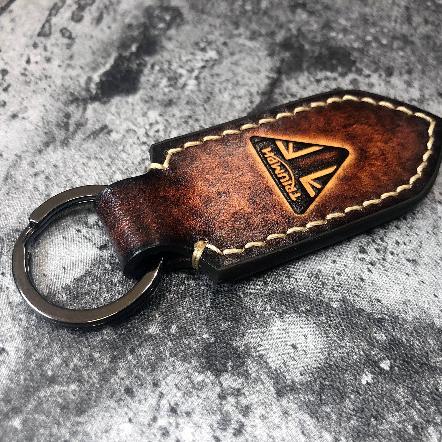 Handmade leather keychain in Brown(Pointed shape) Triumph triangle