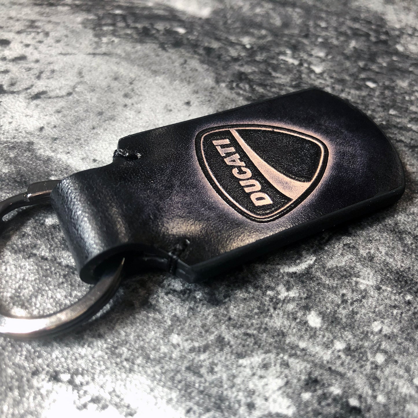 Ducati symbol embossed, vintage Leather keychain in Black. Customizable