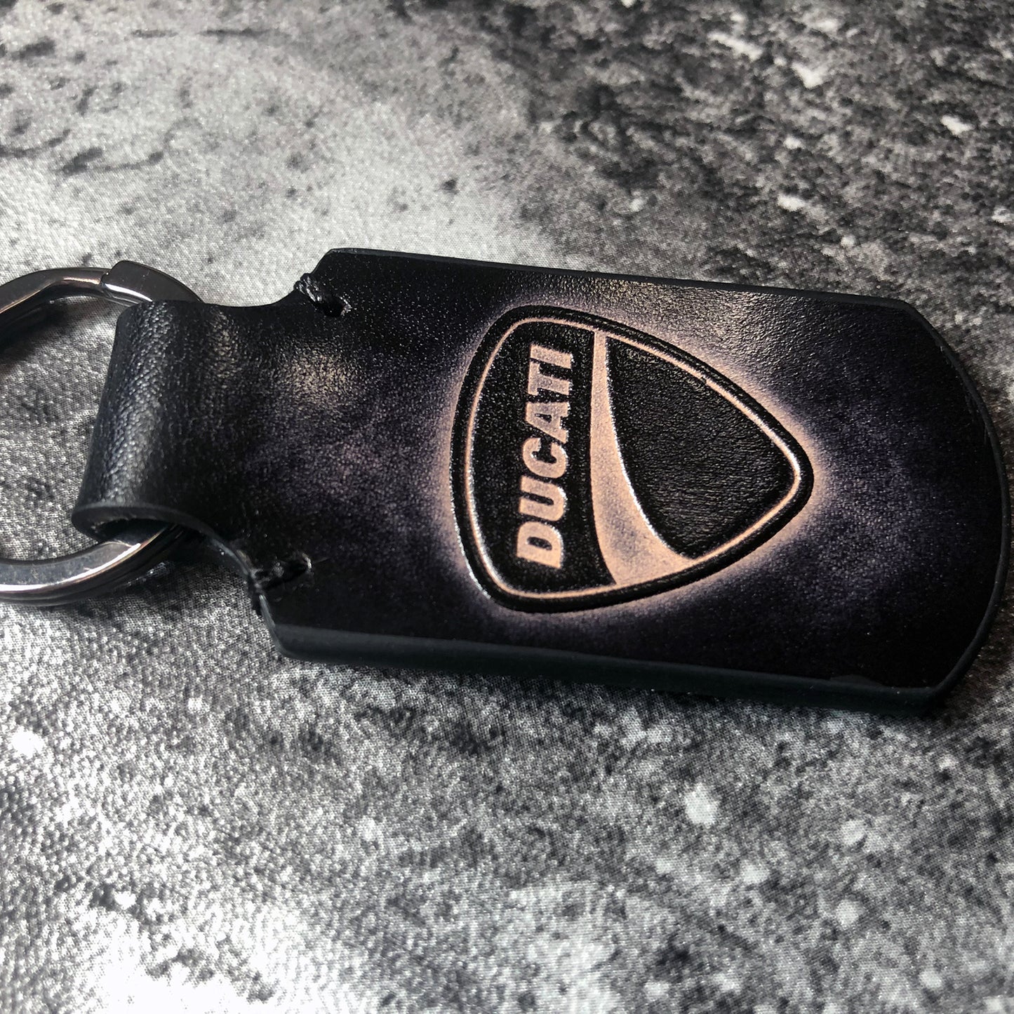 Ducati symbol embossed, vintage Leather keychain in Black. Customizable