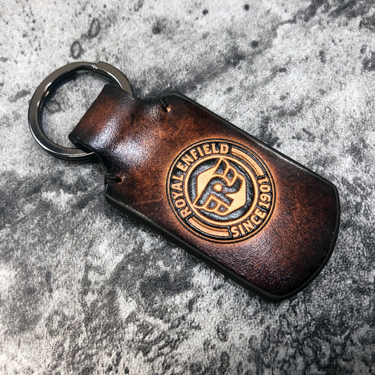 Motorcycle leather keychain in Brown. Royal Enfield symbol is embossed