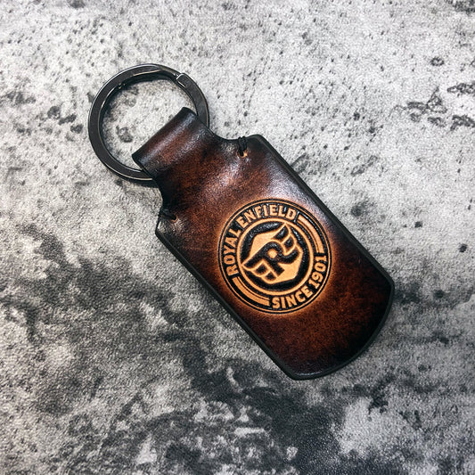 Motorcycle leather keychain in Brown. Royal Enfield symbol is embossed